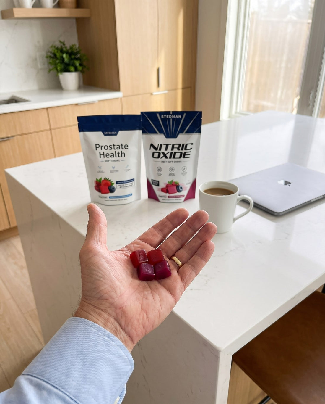 Four Stedman soft chews in hand, with both pouches